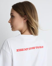 Kiss My Eyes To Sleep tee – white cotton boyfriend t-shirt with red heart graphic by Romy The Brand