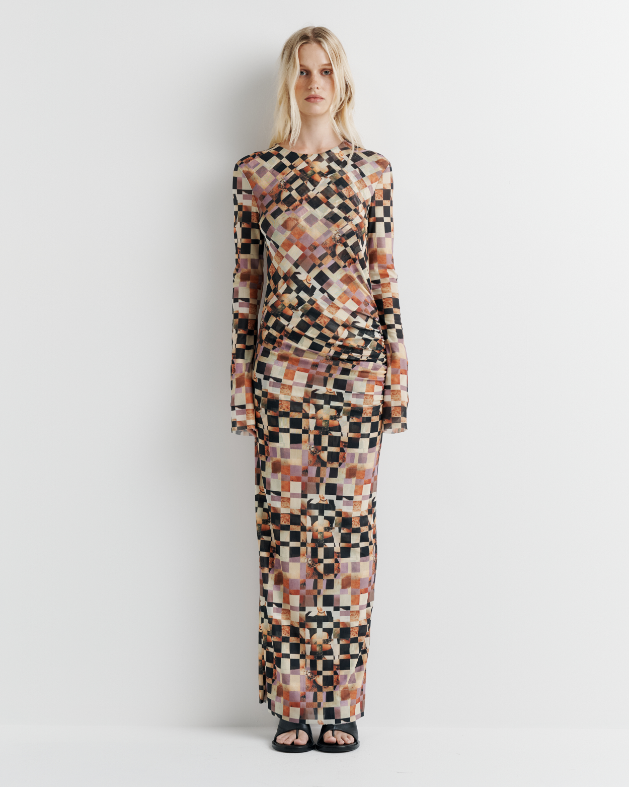 Model wearing the Clara Mesh Dress – long sleeve midi dress with fitted silhouette and delicate mesh fabric by ROMY.