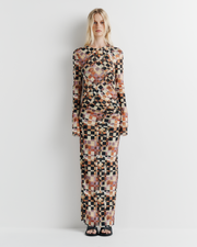 Model wearing the Clara Mesh Dress – long sleeve midi dress with fitted silhouette and delicate mesh fabric by ROMY.