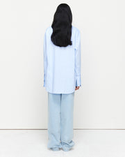 The Classic Cotton Shirt is an oversized essential, crafted from 100% cotton for effortless wear. Featuring a cheeky kiss embroidery under the left collar, this piece showcases exclusive artwork in collaboration with Anouk Colantoni.