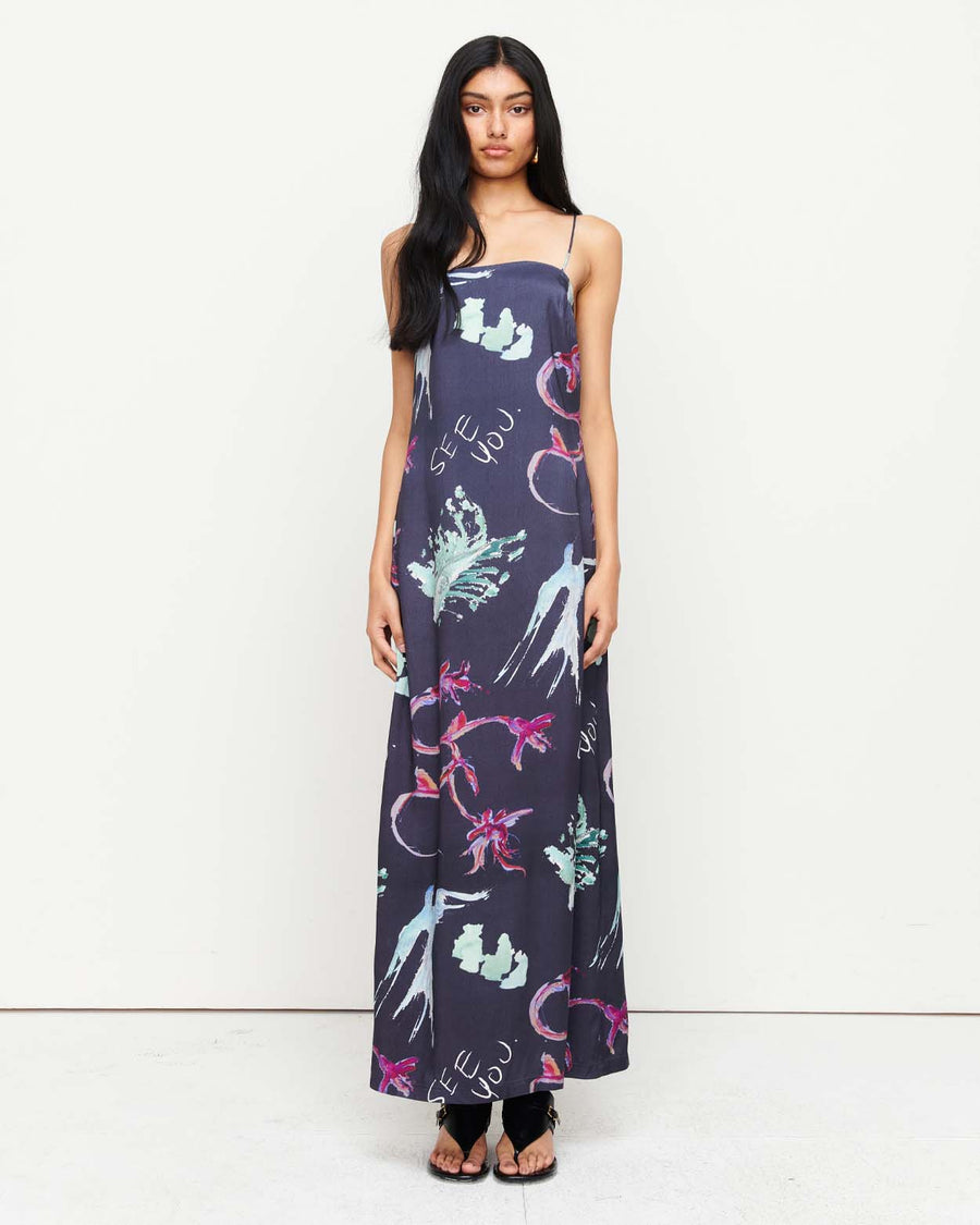 Elegant and timeless, the Joy Slip Dress features a column silhouette with a straight neckline, rouleau straps, and an invisible back zip. Adorned with exclusive artwork by Anouk Colantoni.