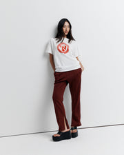 A classic crew neck boyfriend tee, the RAS Heritage Tee features a relaxed fit and is finished with the Romy Athletic Society heritage logo for a timeless, sporty touch.