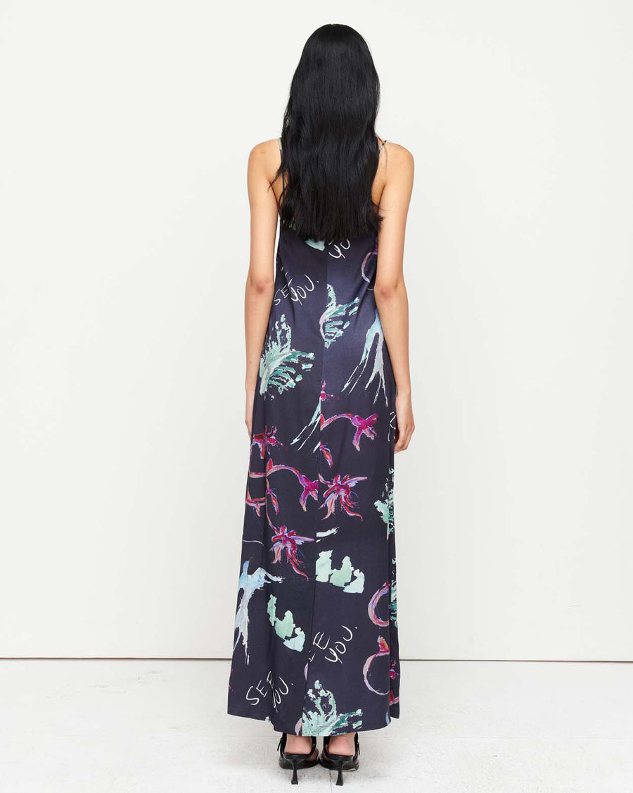 Elegant and timeless, the Joy Slip Dress features a column silhouette with a straight neckline, rouleau straps, and an invisible back zip. Adorned with exclusive artwork by Anouk Colantoni.