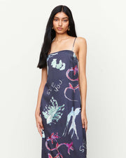 Elegant and timeless, the Joy Slip Dress features a column silhouette with a straight neckline, rouleau straps, and an invisible back zip. Adorned with exclusive artwork by Anouk Colantoni.