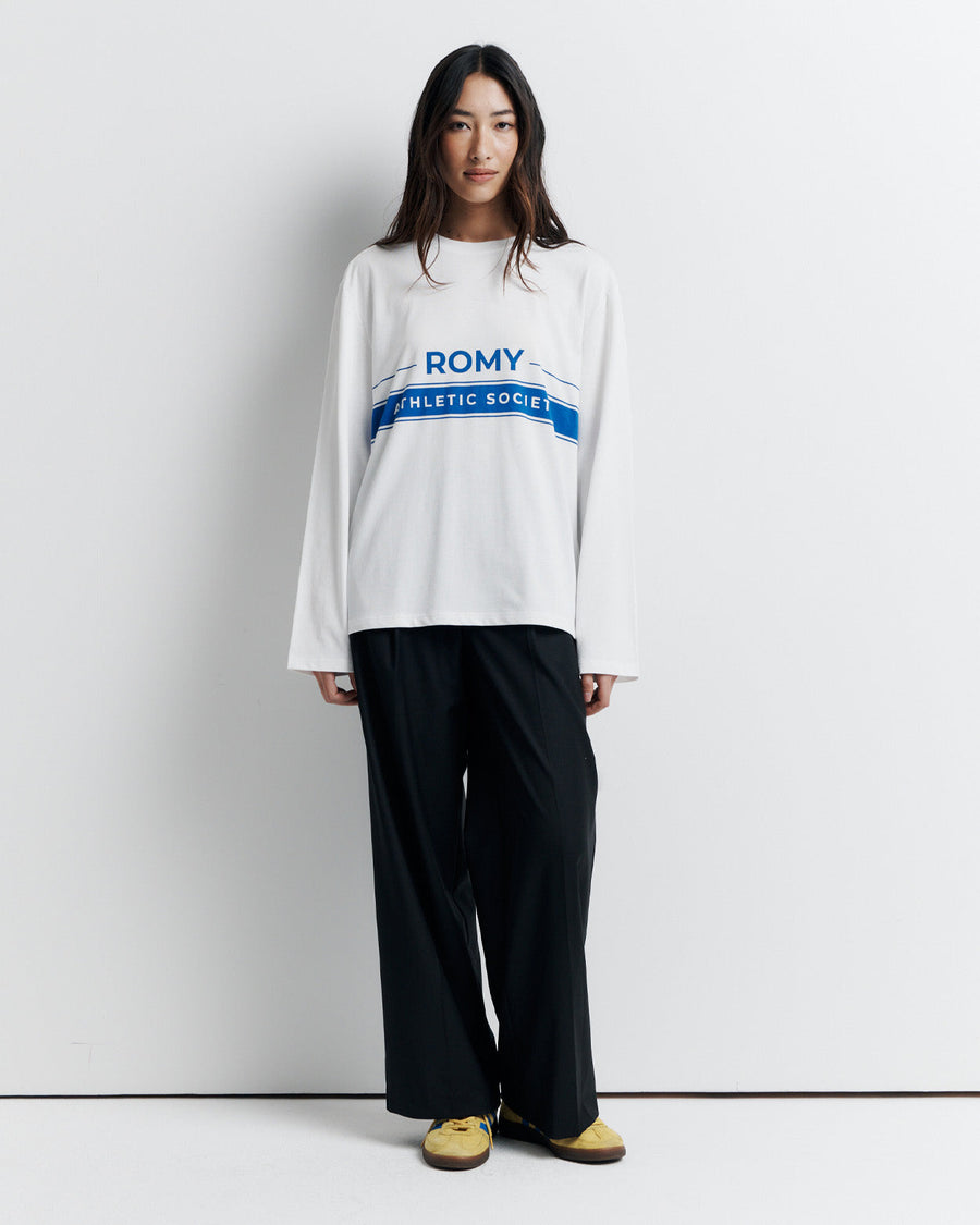 The RAS Long Sleeve Tee is a classic crew neck boyfriend tee with long sleeves, featuring the signature Romy Athletic Society logo for an effortlessly cool, sporty look.