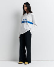 The RAS Long Sleeve Tee is a classic crew neck boyfriend tee with long sleeves, featuring the signature Romy Athletic Society logo for an effortlessly cool, sporty look.