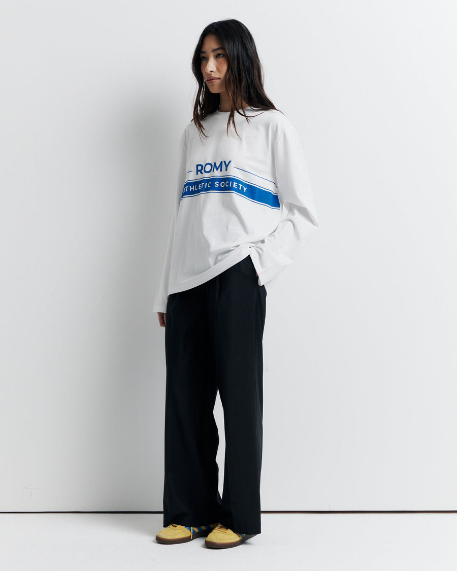 The RAS Long Sleeve Tee is a classic crew neck boyfriend tee with long sleeves, featuring the signature Romy Athletic Society logo for an effortlessly cool, sporty look.