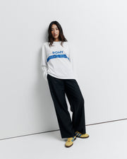 The RAS Long Sleeve Tee is a classic crew neck boyfriend tee with long sleeves, featuring the signature Romy Athletic Society logo for an effortlessly cool, sporty look.