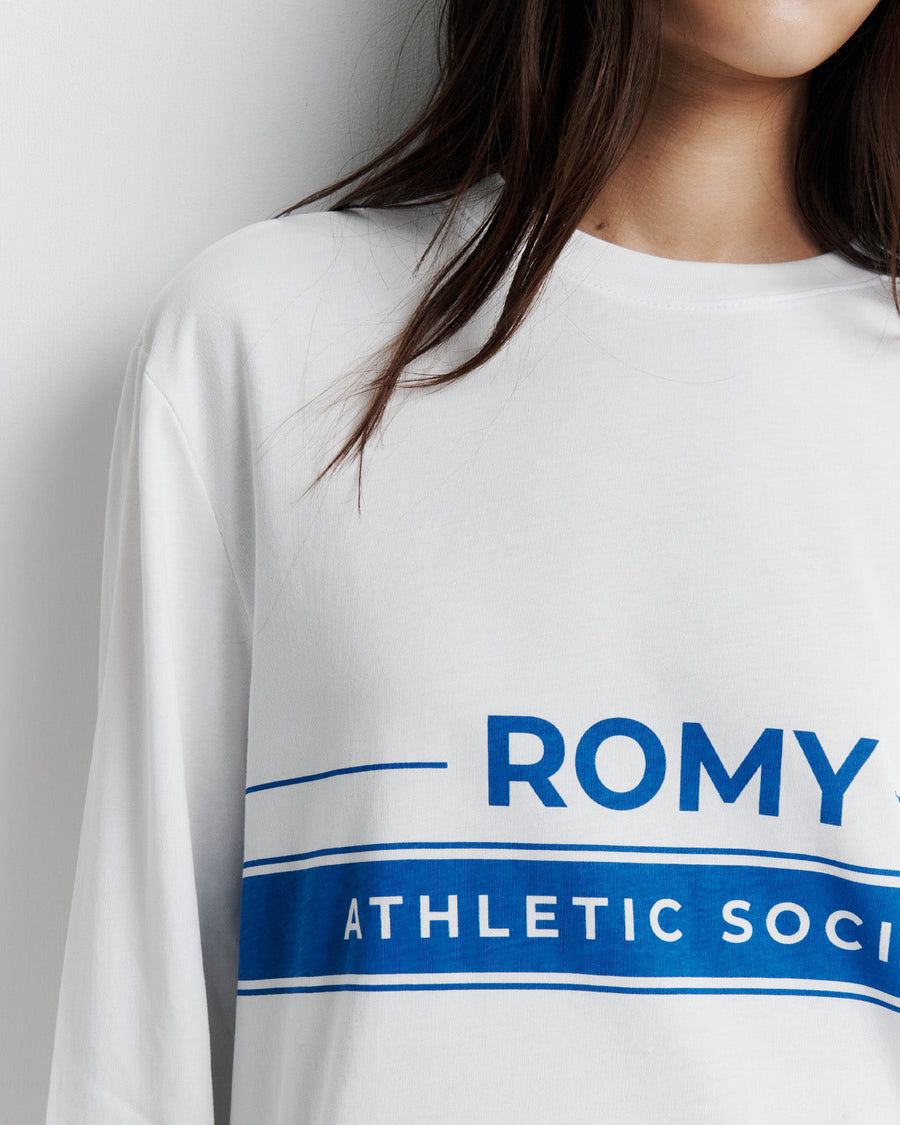 The RAS Long Sleeve Tee is a classic crew neck boyfriend tee with long sleeves, featuring the signature Romy Athletic Society logo for an effortlessly cool, sporty look.
