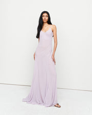 The Charlie Gown in Lilac is a reimagined Romy favorite, featuring a floor-length silhouette, adjustable straps, and a separate slip. Crafted from 100% polyester for effortless elegance and versatility.