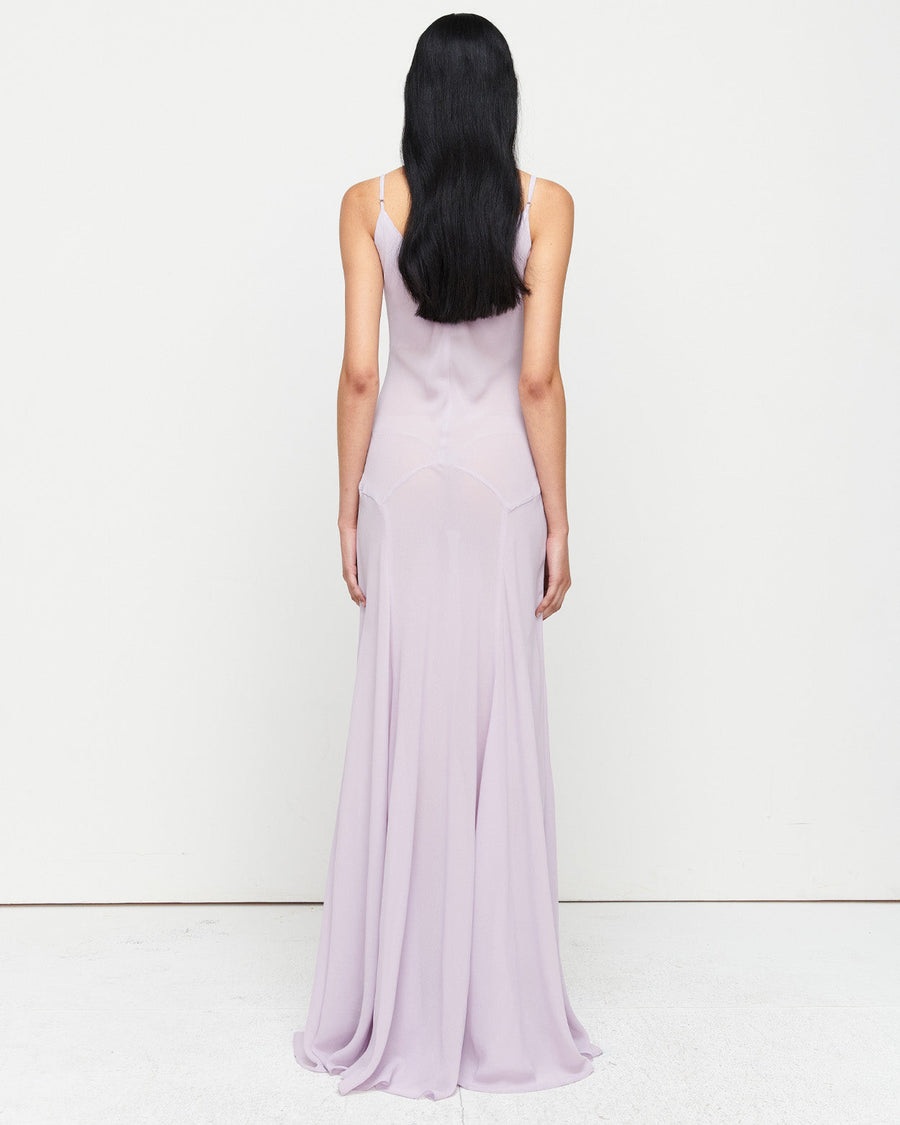 The Charlie Gown in Lilac is a reimagined Romy favorite, featuring a floor-length silhouette, adjustable straps, and a separate slip. Crafted from 100% polyester for effortless elegance and versatility.