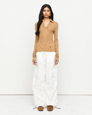 Elevate your wardrobe with the Louise Knit Top in Tan—a collared Henley-style design featuring soft gathers over the bust and elongated sleeves for effortless layering. Crafted from a luxe blend of Lyocell, acrylic, and wool, and finished with our signature ‘R’ embroidery.