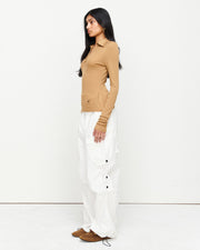 Elevate your wardrobe with the Louise Knit Top in Tan—a collared Henley-style design featuring soft gathers over the bust and elongated sleeves for effortless layering. Crafted from a luxe blend of Lyocell, acrylic, and wool, and finished with our signature ‘R’ embroidery.