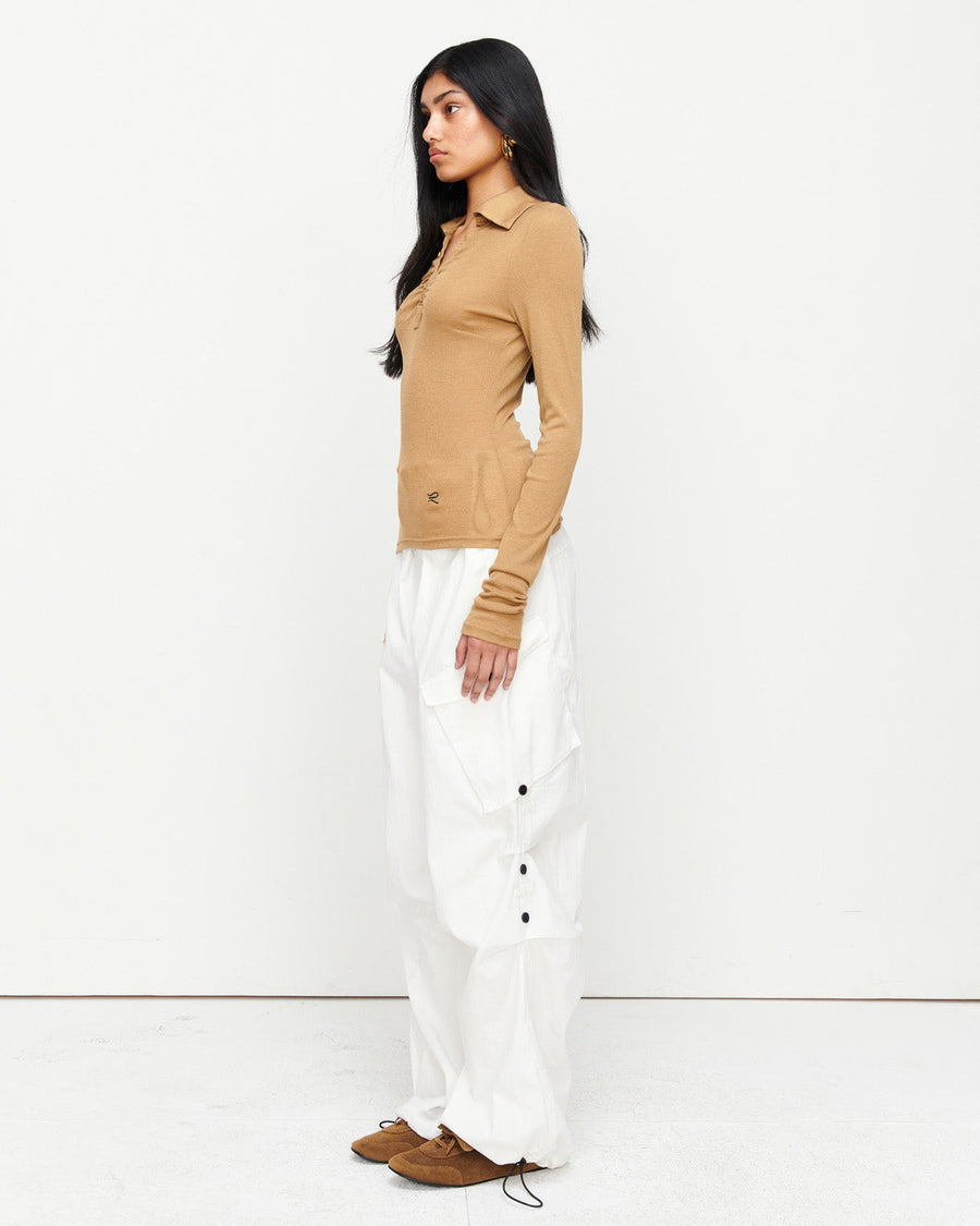 Elevate your wardrobe with the Louise Knit Top in Tan—a collared Henley-style design featuring soft gathers over the bust and elongated sleeves for effortless layering. Crafted from a luxe blend of Lyocell, acrylic, and wool, and finished with our signature ‘R’ embroidery.