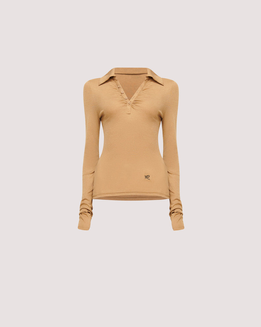 Elevate your wardrobe with the Louise Knit Top in Tan—a collared Henley-style design featuring soft gathers over the bust and elongated sleeves for effortless layering. Crafted from a luxe blend of Lyocell, acrylic, and wool, and finished with our signature ‘R’ embroidery.
