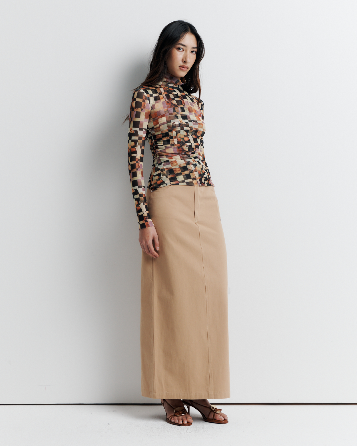 Model wearing the Blake Top – Mosaic Dreams print long sleeve blouse with soft drape and relaxed silhouette by ROMY.