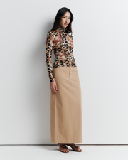 Model wearing the Blake Top – Mosaic Dreams print long sleeve blouse with soft drape and relaxed silhouette by ROMY.