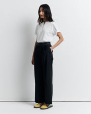 The RAS Pant by Romy Athletic Society combines everyday comfort with elevated style. Crafted from a luxurious wool blend, it features a sporty elastic waistband, side pockets, a faux fly, and a single welt back pocket.