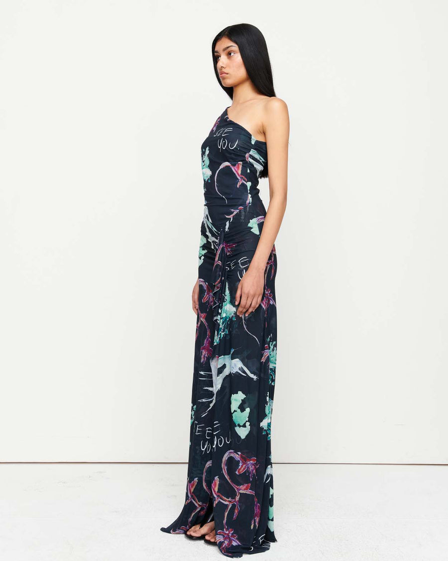 Turn heads in the Naomi Dress – a one-shoulder design featuring a cascading ruffle detail, thigh-high split, and a floor-length silhouette. Adorned with exclusive artwork by Anouk Colantoni.