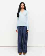Elevate your wardrobe with the Louise Knit Top in Blue—a collared Henley-style design featuring soft gathers over the bust and elongated sleeves for effortless layering. Crafted from a luxe blend of Lyocell, acrylic, and wool, and finished with our signature ‘R’ embroidery.