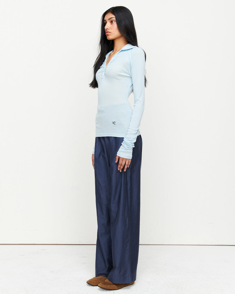 Elevate your wardrobe with the Louise Knit Top in Blue—a collared Henley-style design featuring soft gathers over the bust and elongated sleeves for effortless layering. Crafted from a luxe blend of Lyocell, acrylic, and wool, and finished with our signature ‘R’ embroidery.