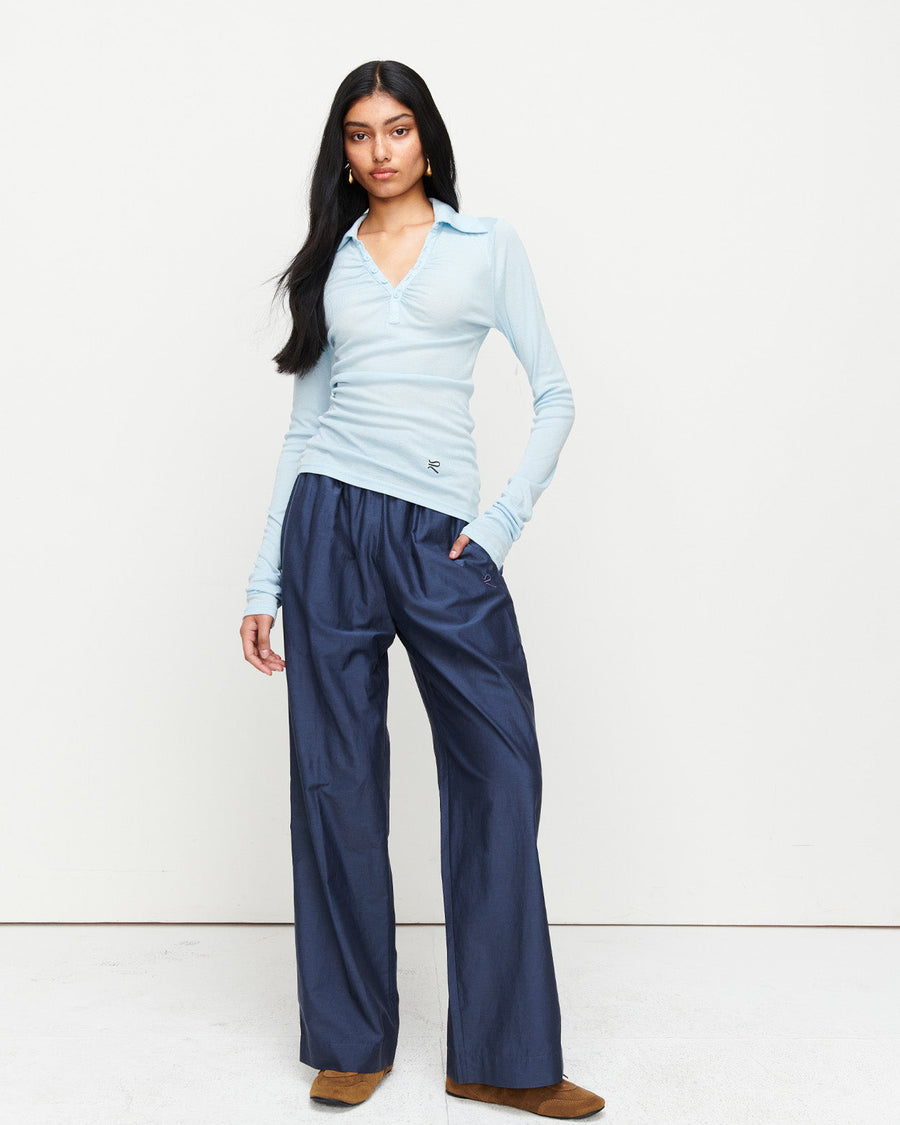 Elevate your wardrobe with the Louise Knit Top in Blue—a collared Henley-style design featuring soft gathers over the bust and elongated sleeves for effortless layering. Crafted from a luxe blend of Lyocell, acrylic, and wool, and finished with our signature ‘R’ embroidery.