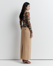 Model wearing the Blake Top – Mosaic Dreams print long sleeve blouse with soft drape and relaxed silhouette by ROMY.