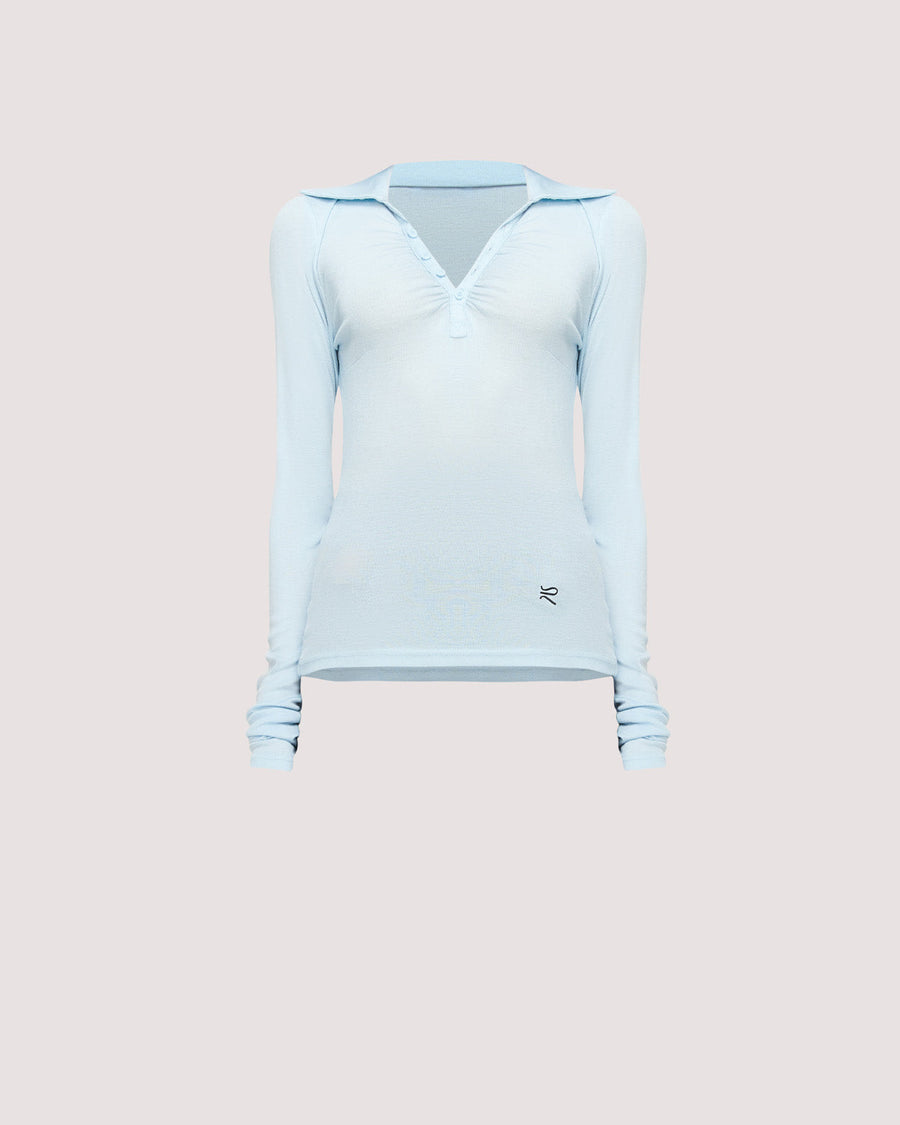 Elevate your wardrobe with the Louise Knit Top in Blue—a collared Henley-style design featuring soft gathers over the bust and elongated sleeves for effortless layering. Crafted from a luxe blend of Lyocell, acrylic, and wool, and finished with our signature ‘R’ embroidery.