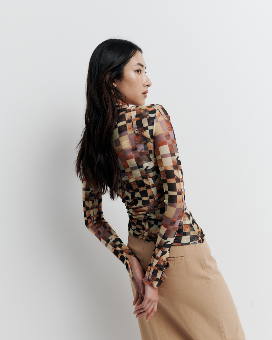 Model wearing the Blake Top – Mosaic Dreams print long sleeve blouse with soft drape and relaxed silhouette by ROMY.