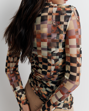Model wearing the Blake Top – Mosaic Dreams print long sleeve blouse with soft drape and relaxed silhouette by ROMY.