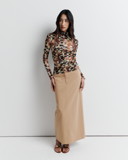 Model wearing the Blake Top – Mosaic Dreams print long sleeve blouse with soft drape and relaxed silhouette by ROMY.