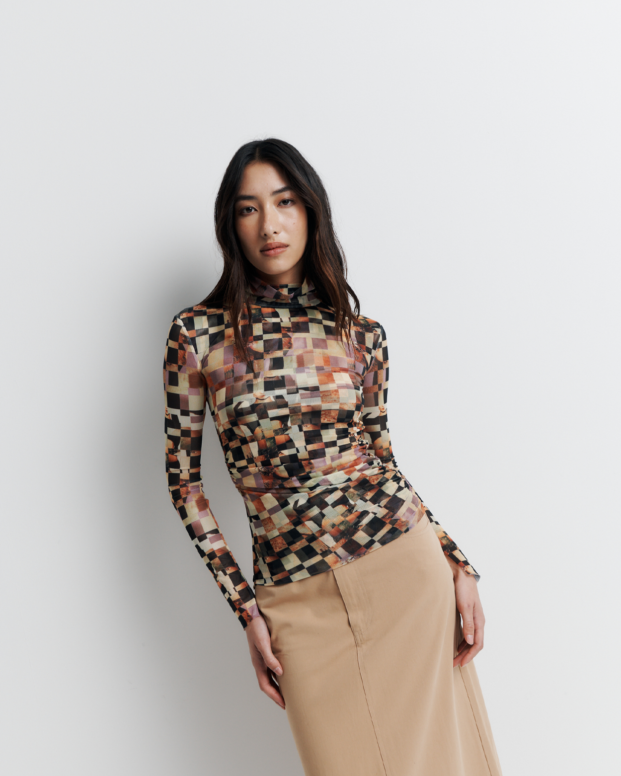 Model wearing the Blake Top – Mosaic Dreams print long sleeve blouse with soft drape and relaxed silhouette by ROMY.
