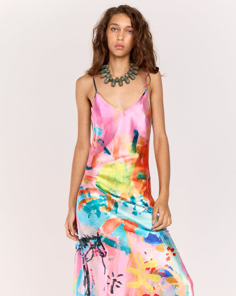 Discover the Rodeo Satin Maxi Dress, showcasing a limited-edition print by artist Jake Pedro. With a flattering V-neckline, adjustable straps, and a graceful floor-length hem, this luxurious satin dress with a subtle sheen is perfect for effortlessly transitioning from day to evening.