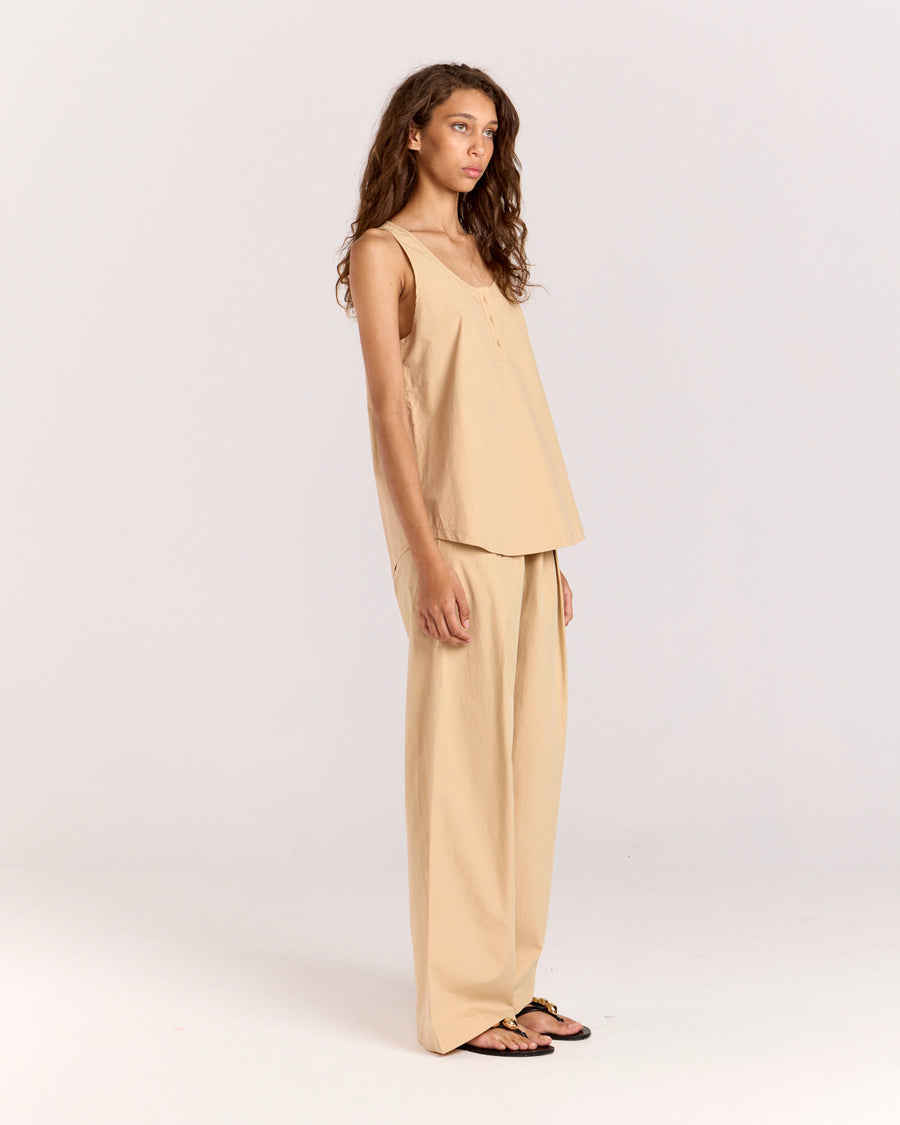 Introducing the Summer Tank, featuring an elegant scoop neckline adorned with self-covered buttons. Cut in an off-the-body, relaxed silhouette, this tank is crafted from beautifully soft cotton-tencel fabric that moves effortlessly with you, making it a perfect addition to your warm-weather wardrobe.
