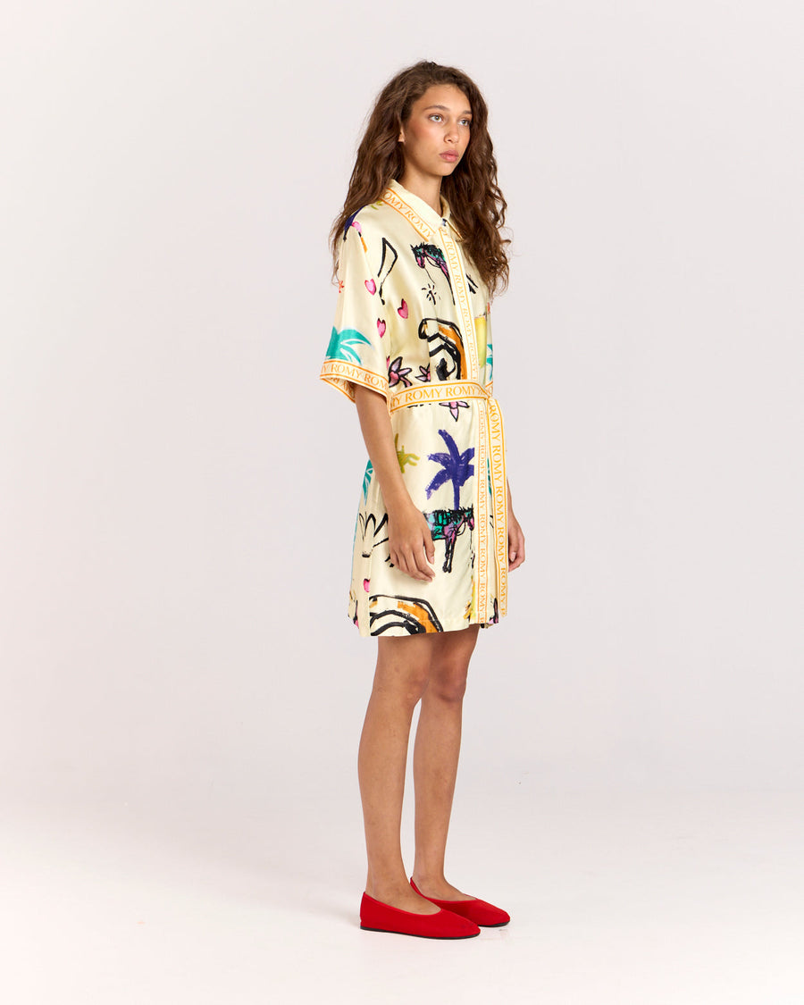 Elevate your style with the Lover Robe, a relaxed shirt-style mini dress featuring Jake Pedro's exclusive Lover Print. Crafted from matte viscose rayon twill, it includes a button front and a removable Romy belt tie for versatile styling.