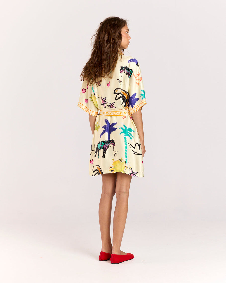 Elevate your style with the Lover Robe, a relaxed shirt-style mini dress featuring Jake Pedro's exclusive Lover Print. Crafted from matte viscose rayon twill, it includes a button front and a removable Romy belt tie for versatile styling.