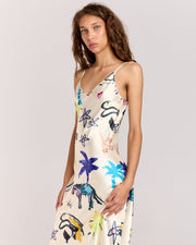 Elevate your style with the Lover Slip Dress, showcasing Jake Pedro's exclusive Lover Print. Crafted from luxurious satin with a high sheen, it features a flattering V-neckline, adjustable straps, and a graceful floor-length hem.